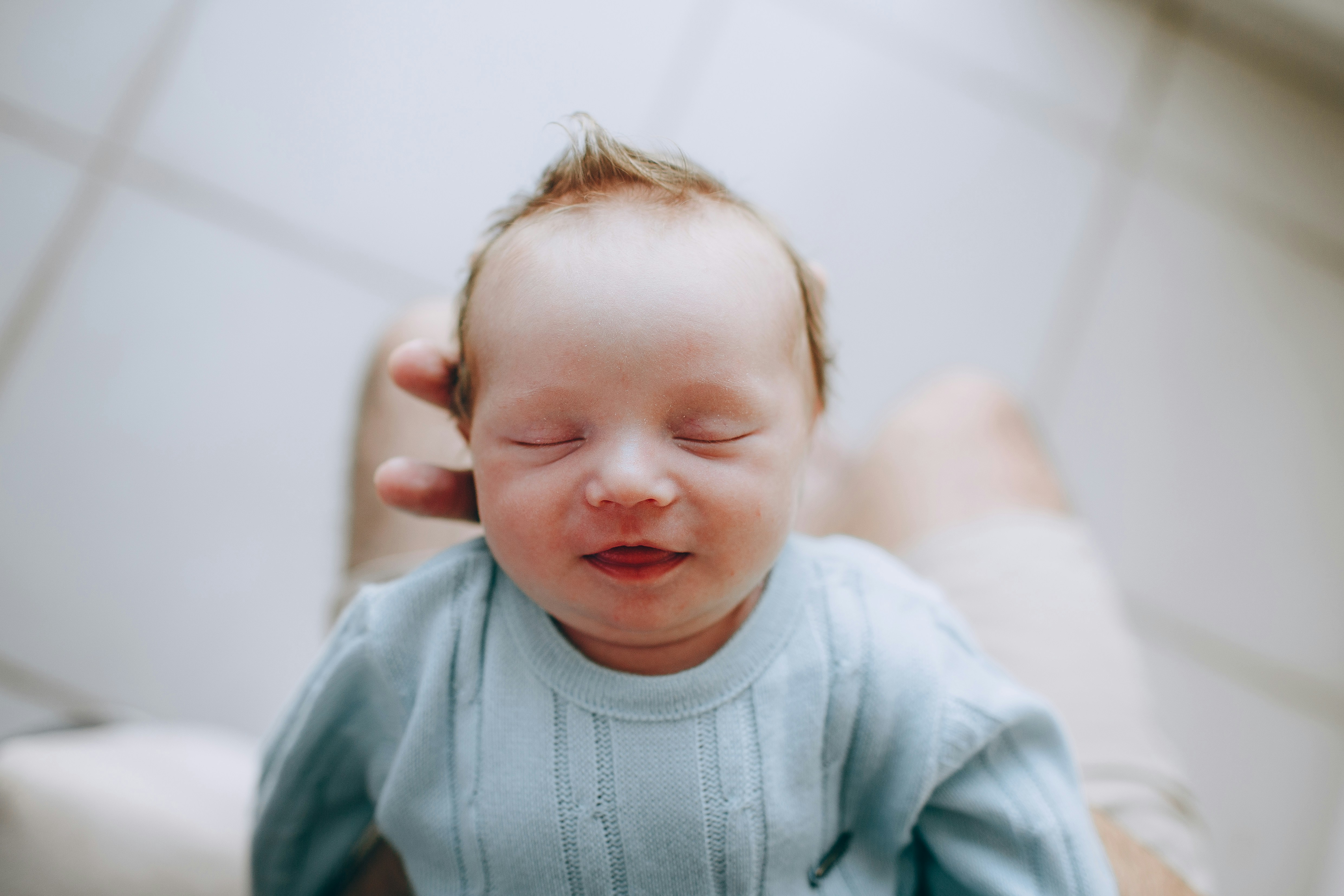 hands holding a baby